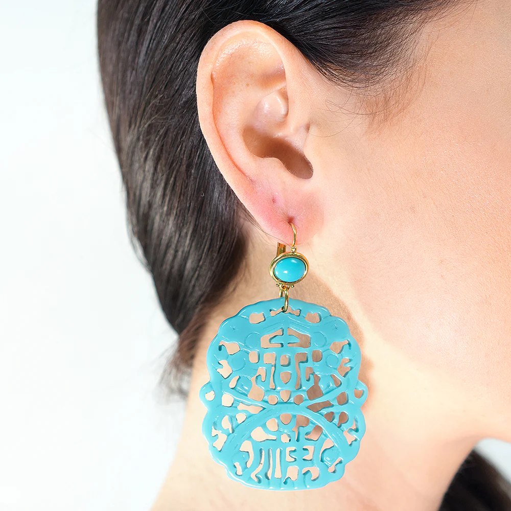 Look like an angel in these carved white resin euro wire top earring with white cabochon. 3" long.