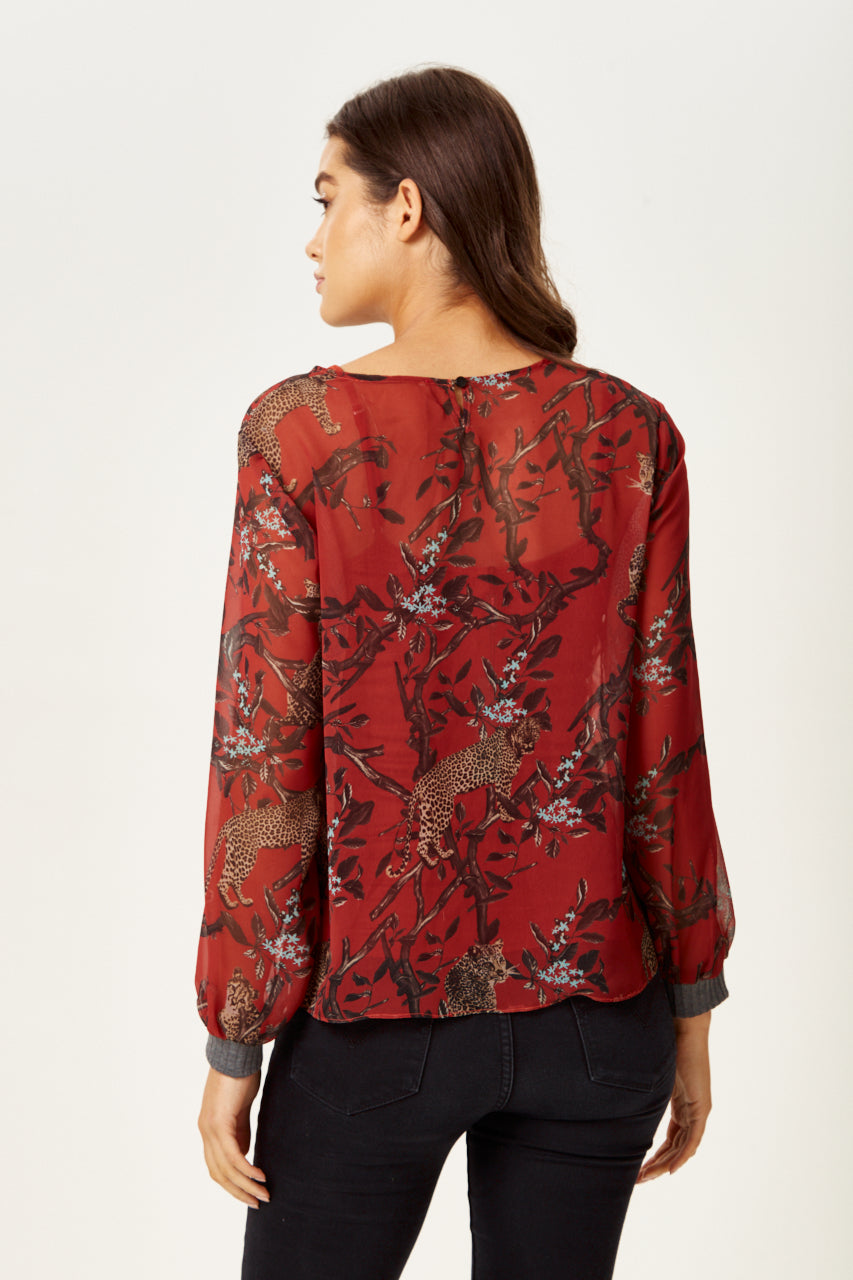 Find trendy luxury dresses online including the Women's Long Sleeve Red Leopard Top. Shop Now!