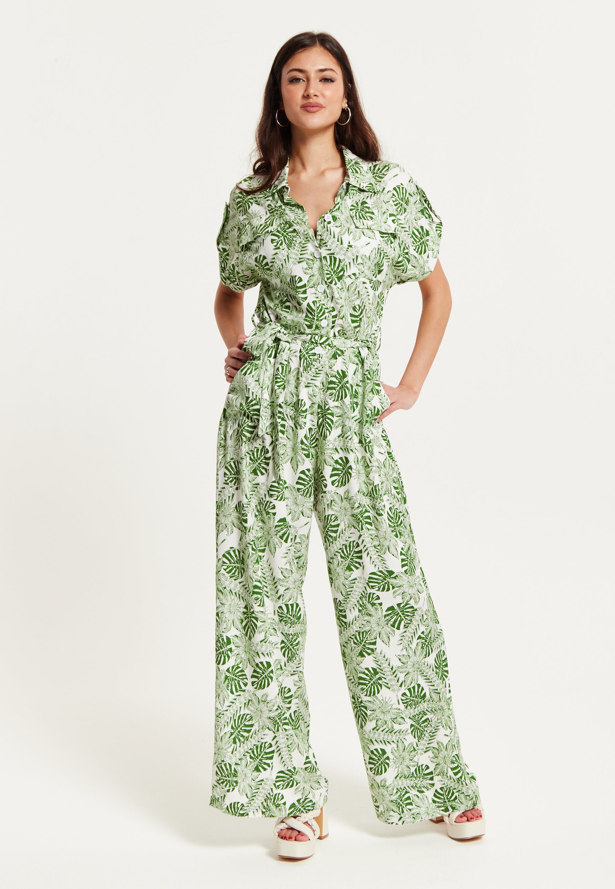 Women's Green Leaf Printed Loose Fit Jumpsuit with Tie Waist and Pocket Details - Liquorish