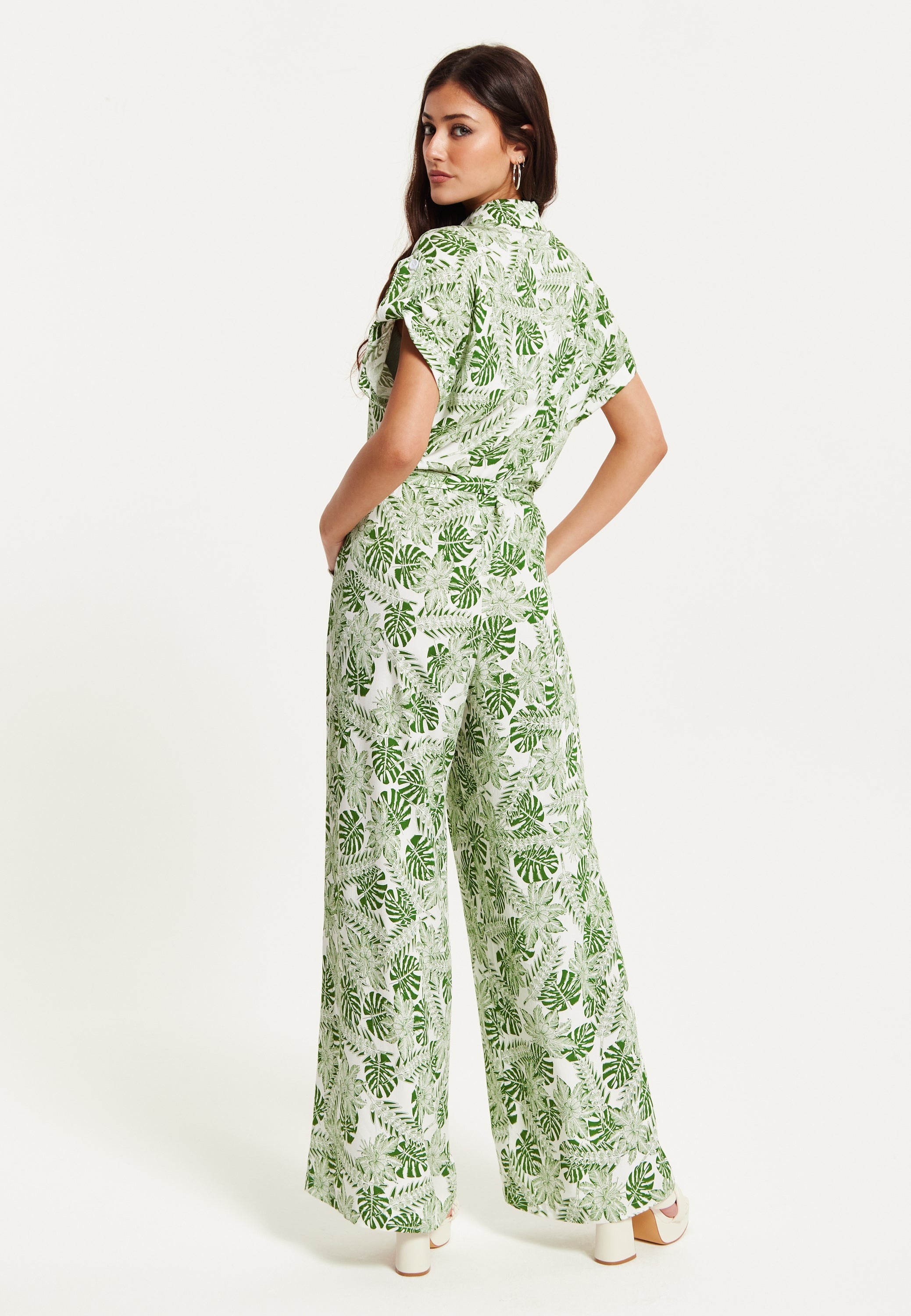 Women's Green Leaf Printed Loose Fit Jumpsuit with Tie Waist and Pocket Details - Liquorish