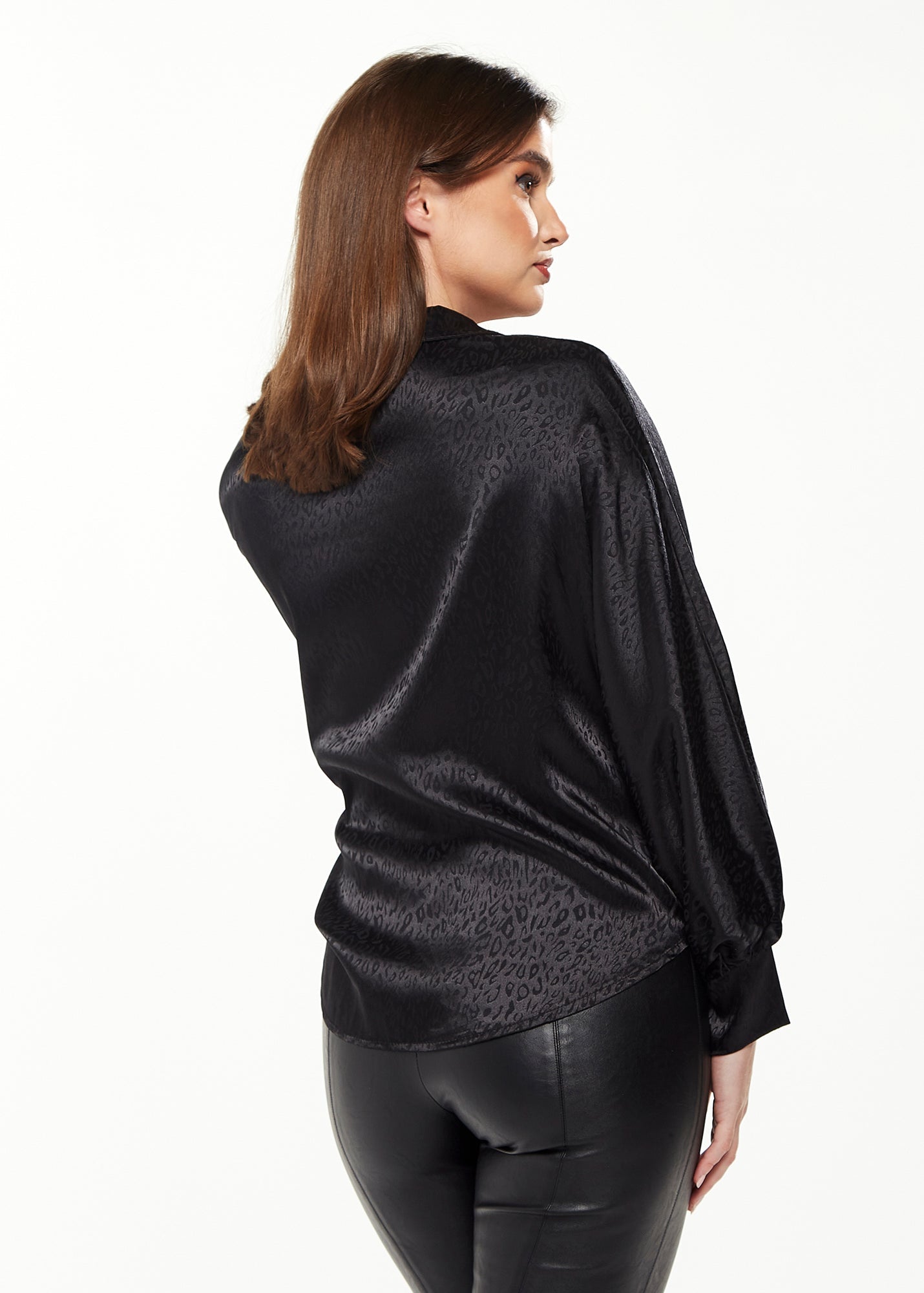 Women's Divine Grace Leopard Jacquard Blouse with Front Waist Tie in Black, Long Sleeves, Button Front, and Collar.