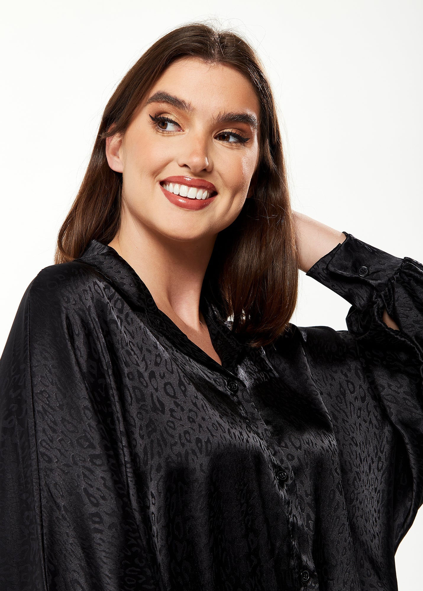 Women's Divine Grace Leopard Jacquard Blouse with Front Waist Tie in Black, Long Sleeves, Button Front, and Collar.