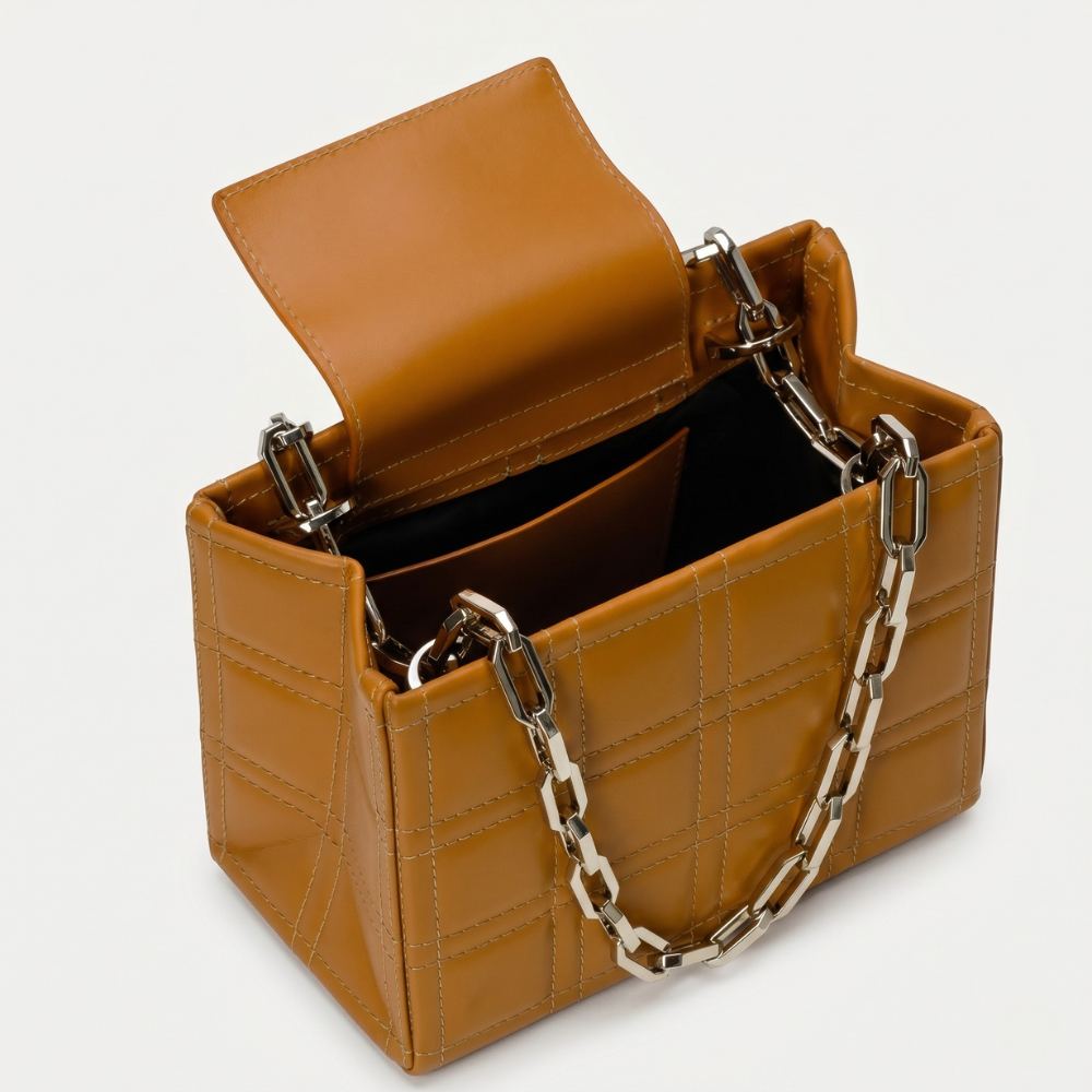 Leather bag with adjustable strap and flap closure, perfect for daily use. Shop online from our curated edit of premium fashion.