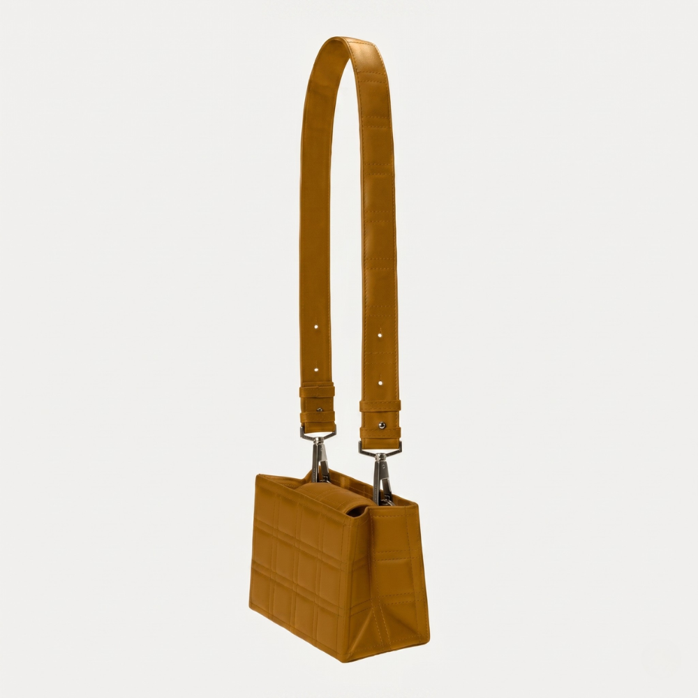 Leather bag with adjustable strap and flap closure, perfect for daily use. Shop online from our curated edit of premium fashion.