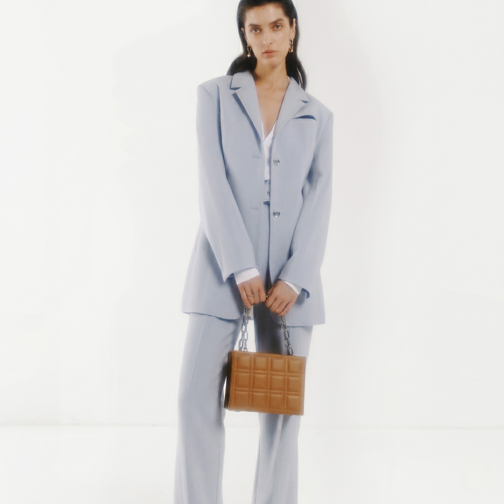 Leather bag with adjustable strap and flap closure, perfect for daily use. Shop online from our curated edit of premium fashion.