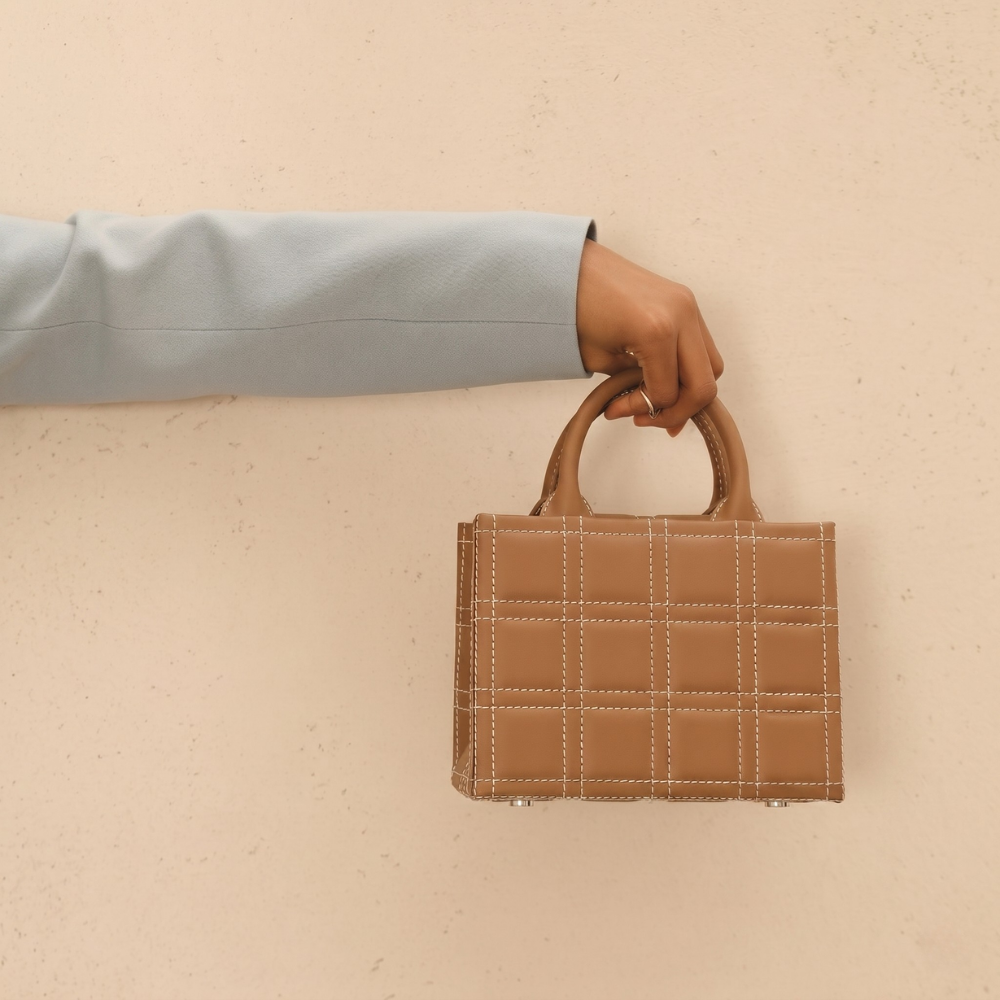 Leather bag with adjustable strap and flap closure, pre order item. Shop online from our curated edit of premium fashion.
