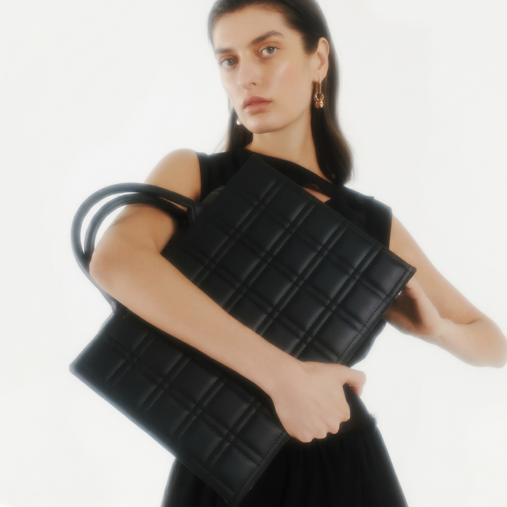 Leather tote bag with adjustable strap and compartments, pre order item. Shop online from our curated edit of premium fashion.
