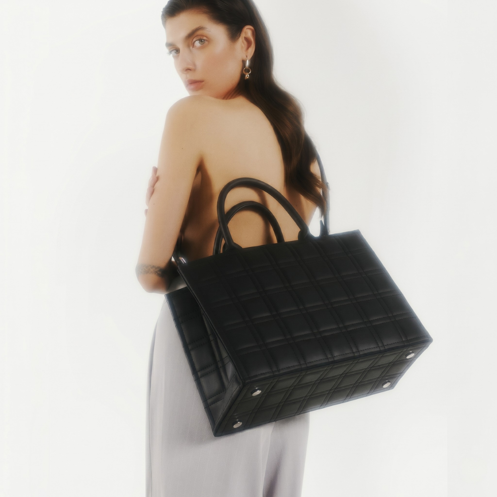Leather tote bag with adjustable strap and compartments, pre order item. Shop online from our curated edit of premium fashion.