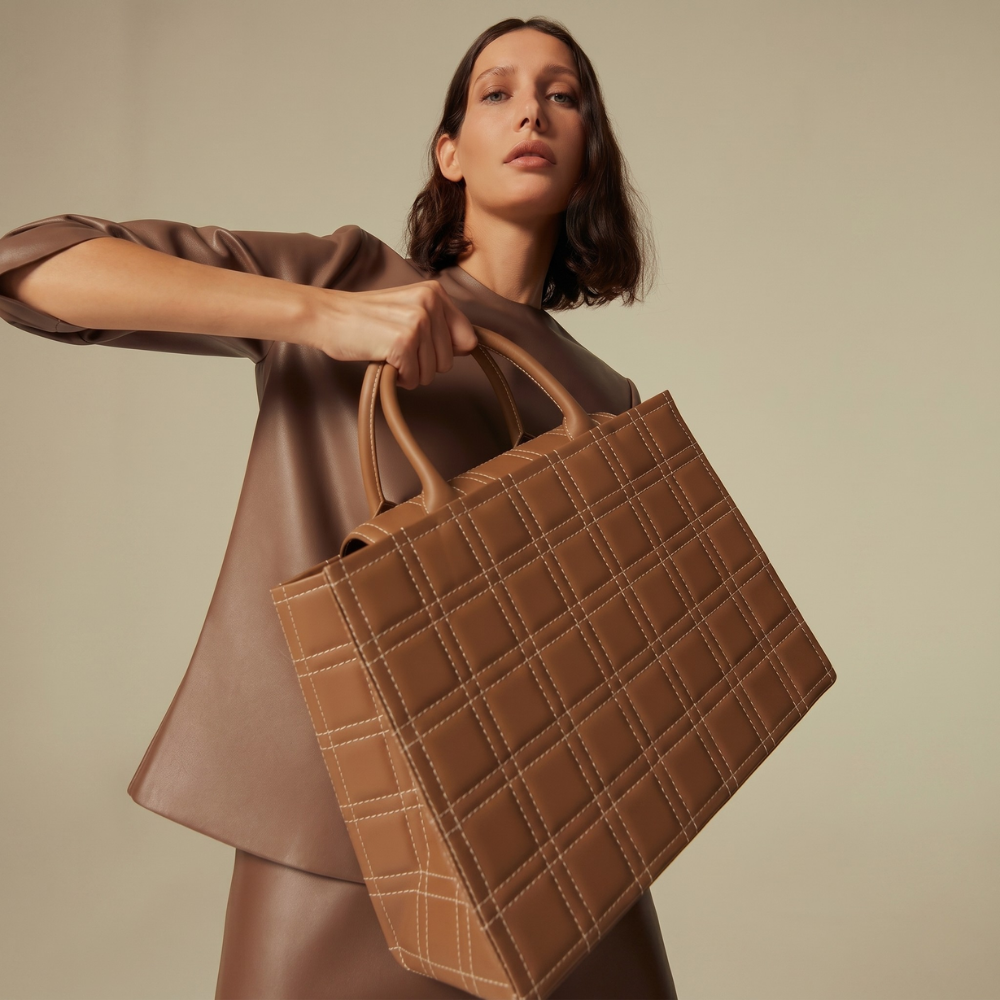 Leather tote bag with flap closure and back pocket, pre order item. Shop online from our curated edit of premium fashion.