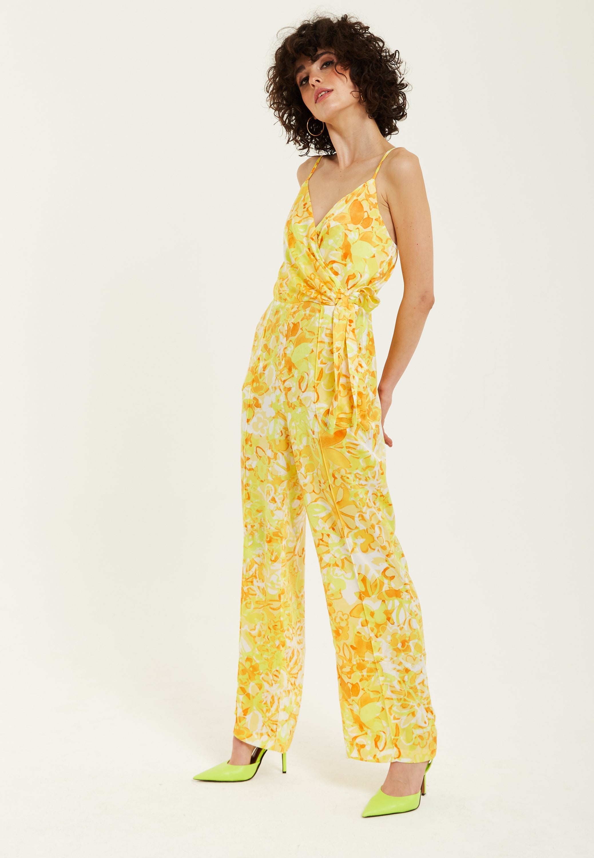 Women's Jumpsuit in Yellow and Orange Floral Print with V-Neck, Adjustable Straps, and Tie Waist - Liquorish