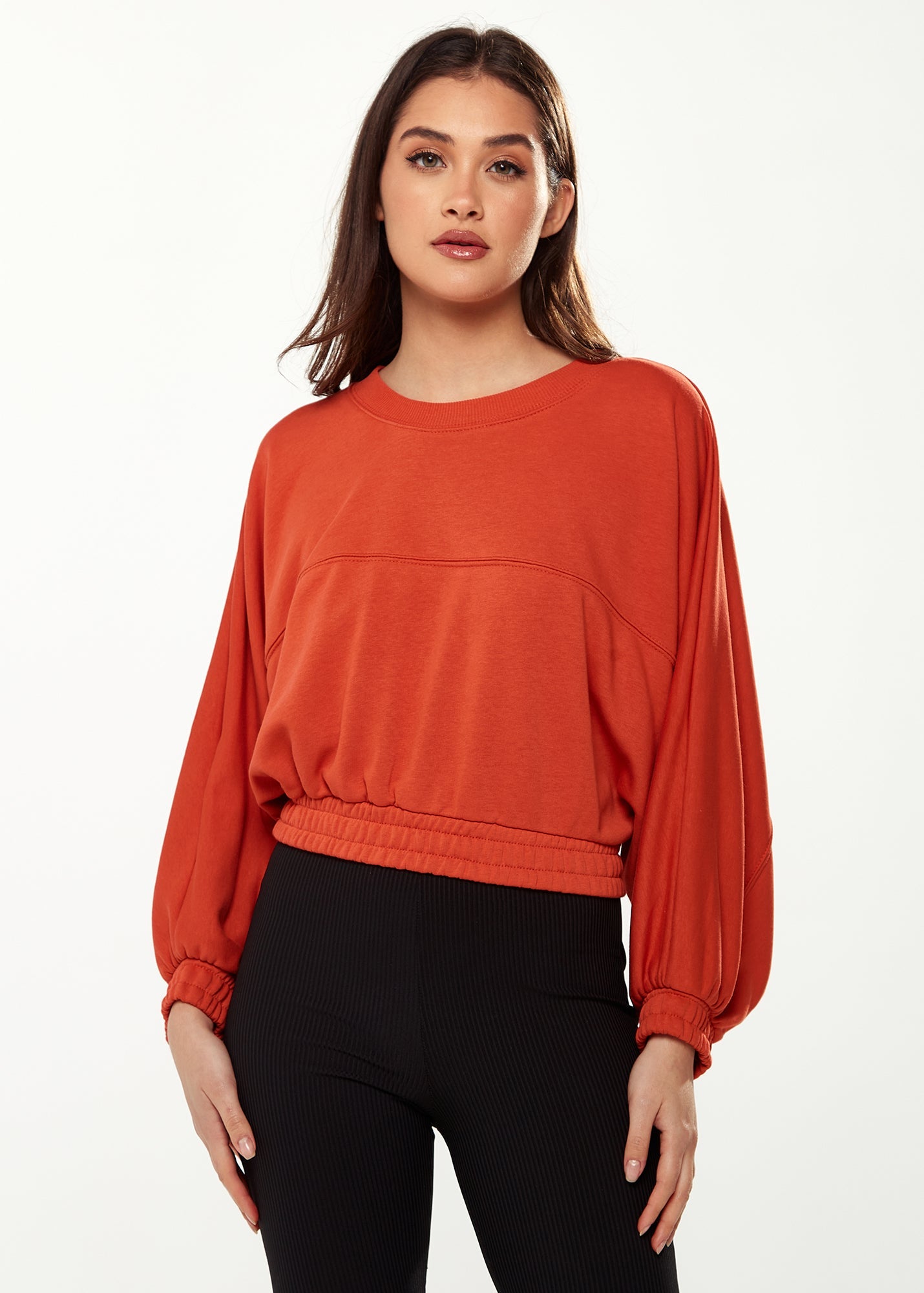 Women's Cropped Sweatshirt in Dark Orange with Voluminous Bat and Balloon Sleeves, Elastic Cuffs, and a Chic Design.
