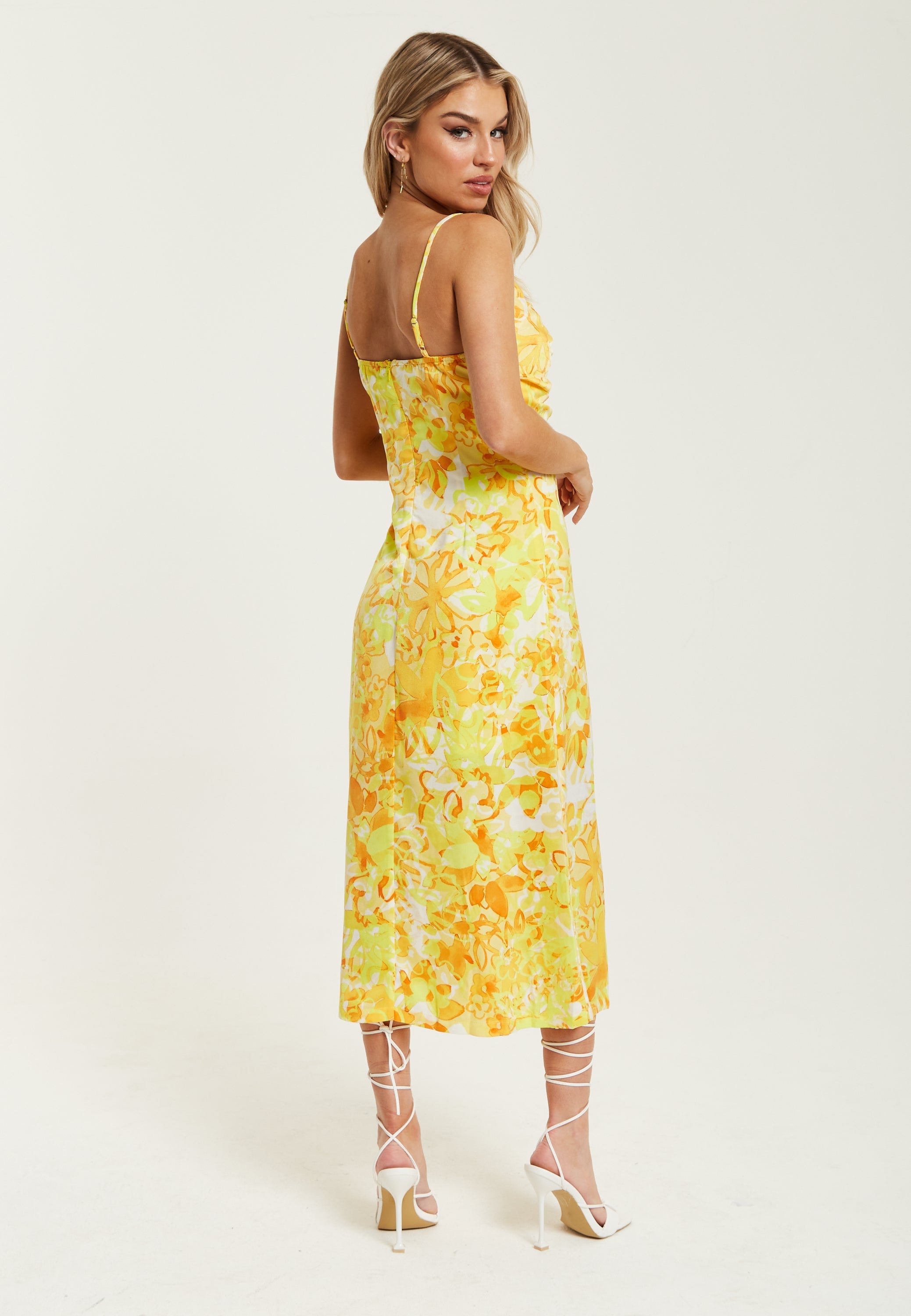 Women's Maxi Dress in Yellow and Orange Floral Print with Sleeveless Design and Ruching Detail - Liquorish