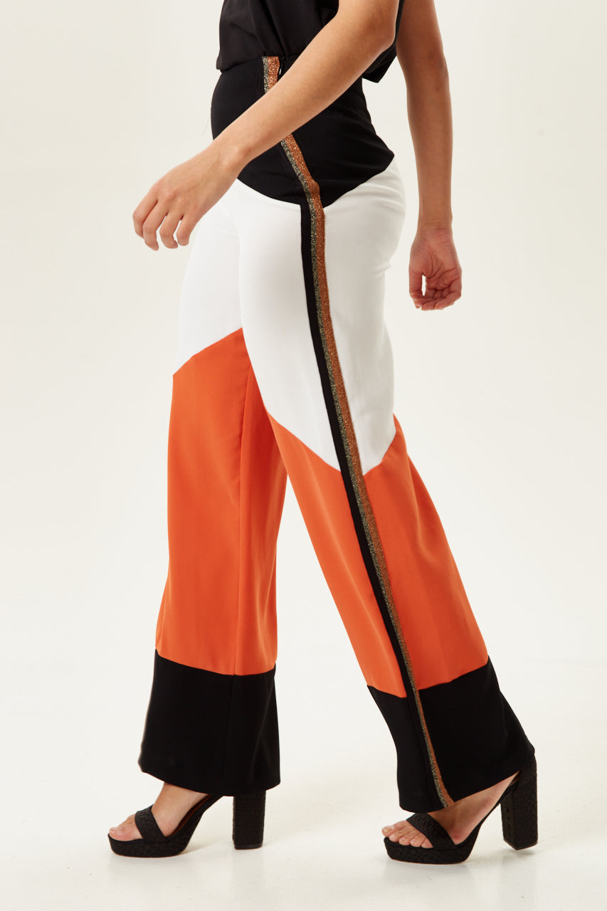Shop luxury women clothing with a chic collection of Women's Trousers to elevate your style. Shop Now!
