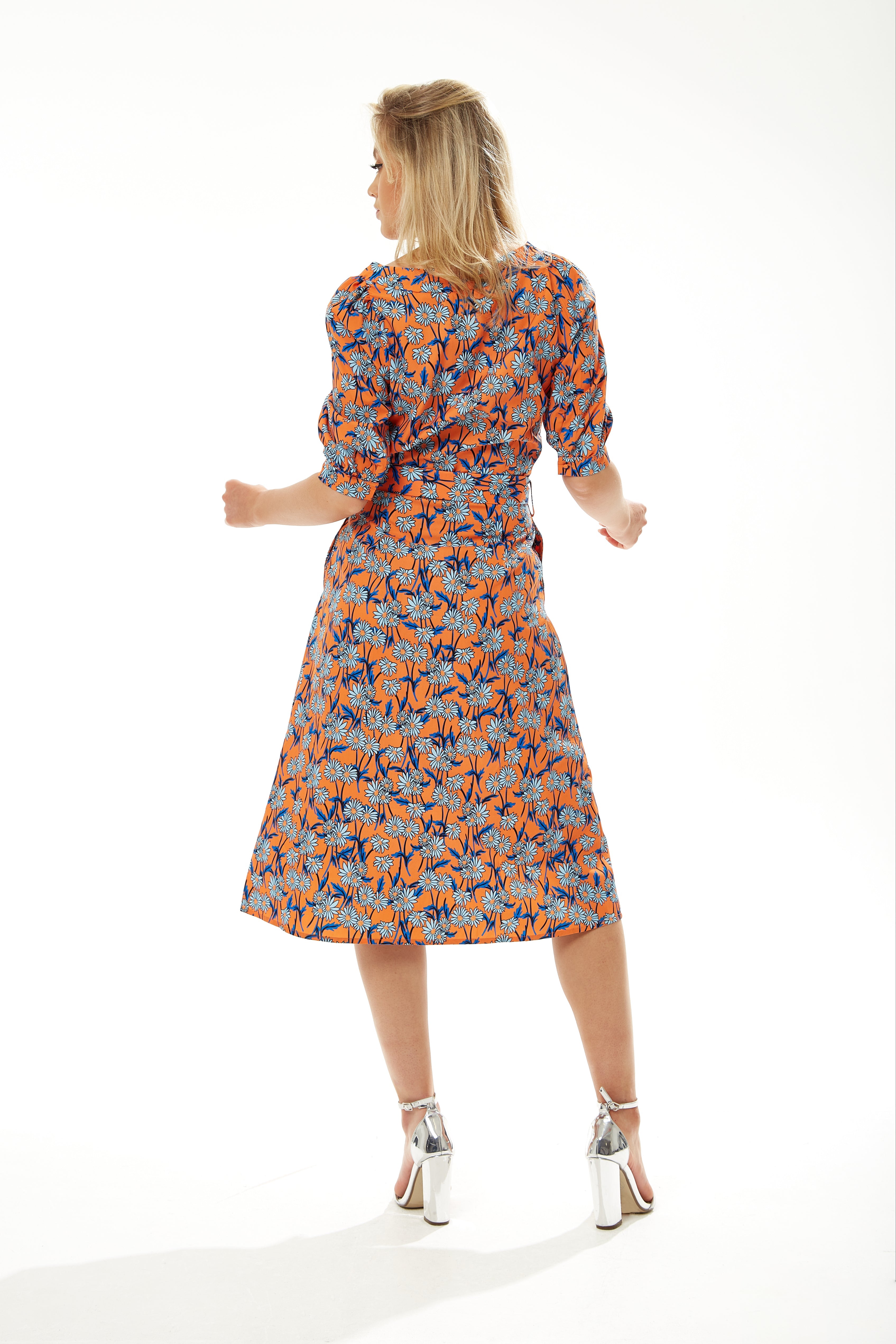 High end clothing for women made chic with the trendy Women's Midi Dress styles. Shop Now!