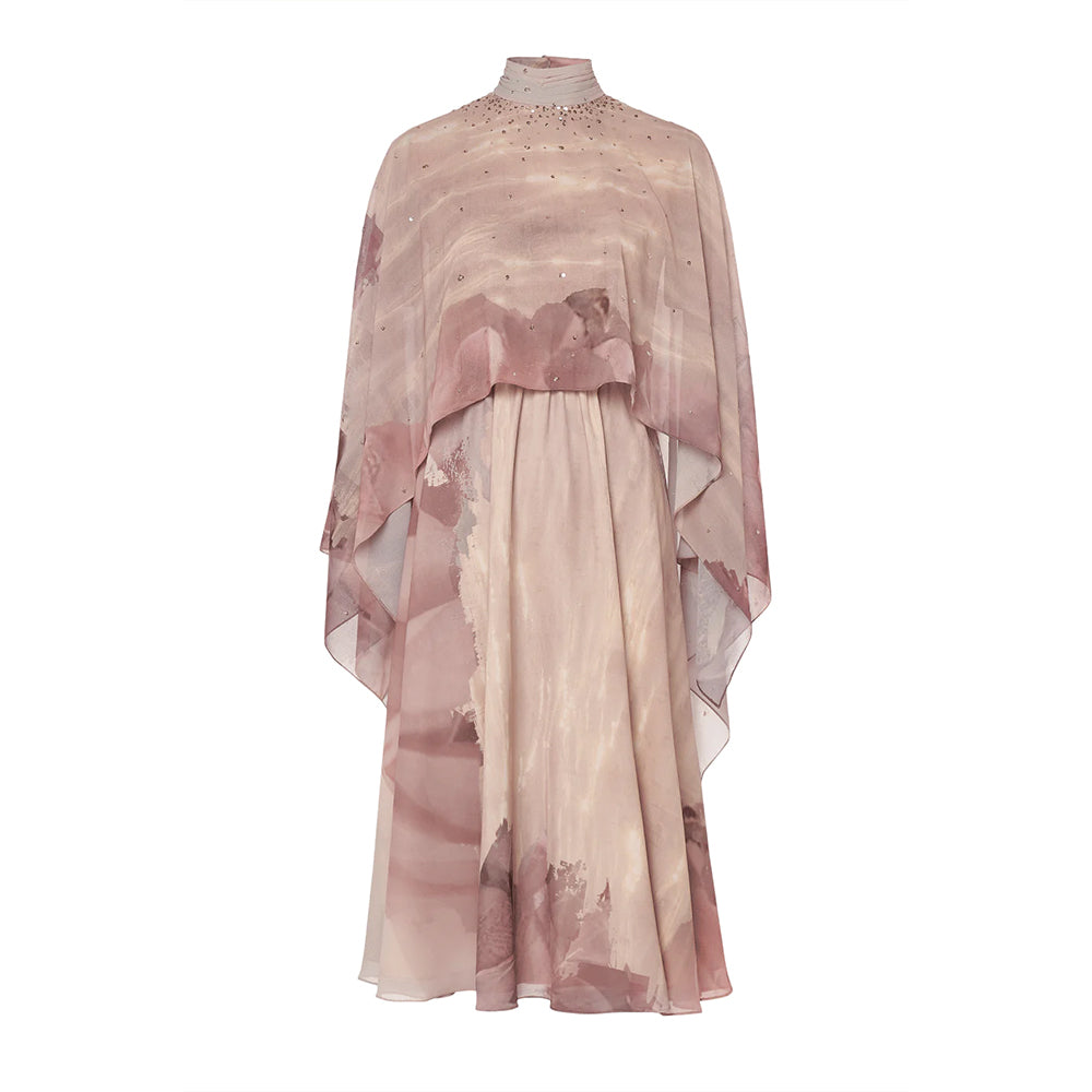 Drape yourself in elegance with this cape-style dress. Adorned with intricate embroidery and a pleated high collar.