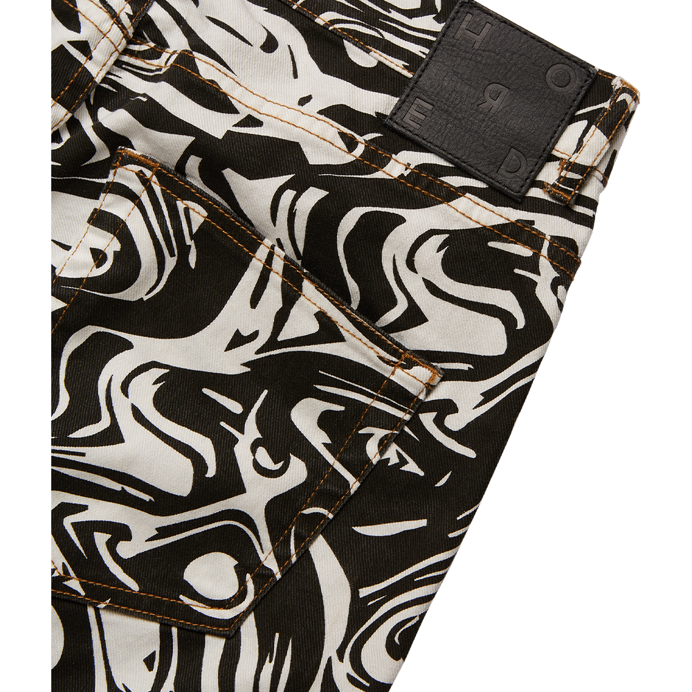 Arden women's off-white jeans feature an all-over abstract marble pattern. 