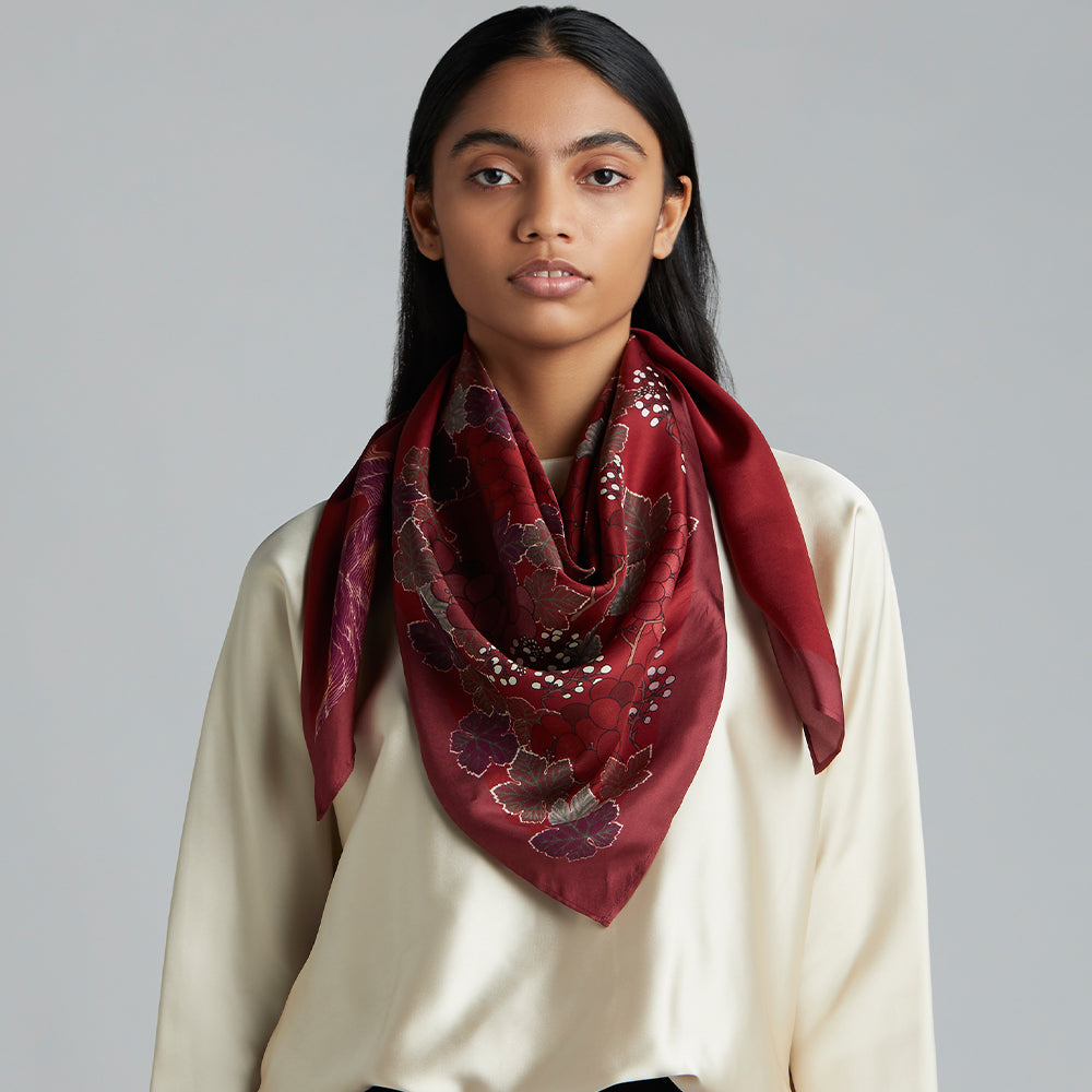 'A Sweet Vintage' scarf adds a flattering pop of merlot to your wardrobe, with its' unique grape flower.