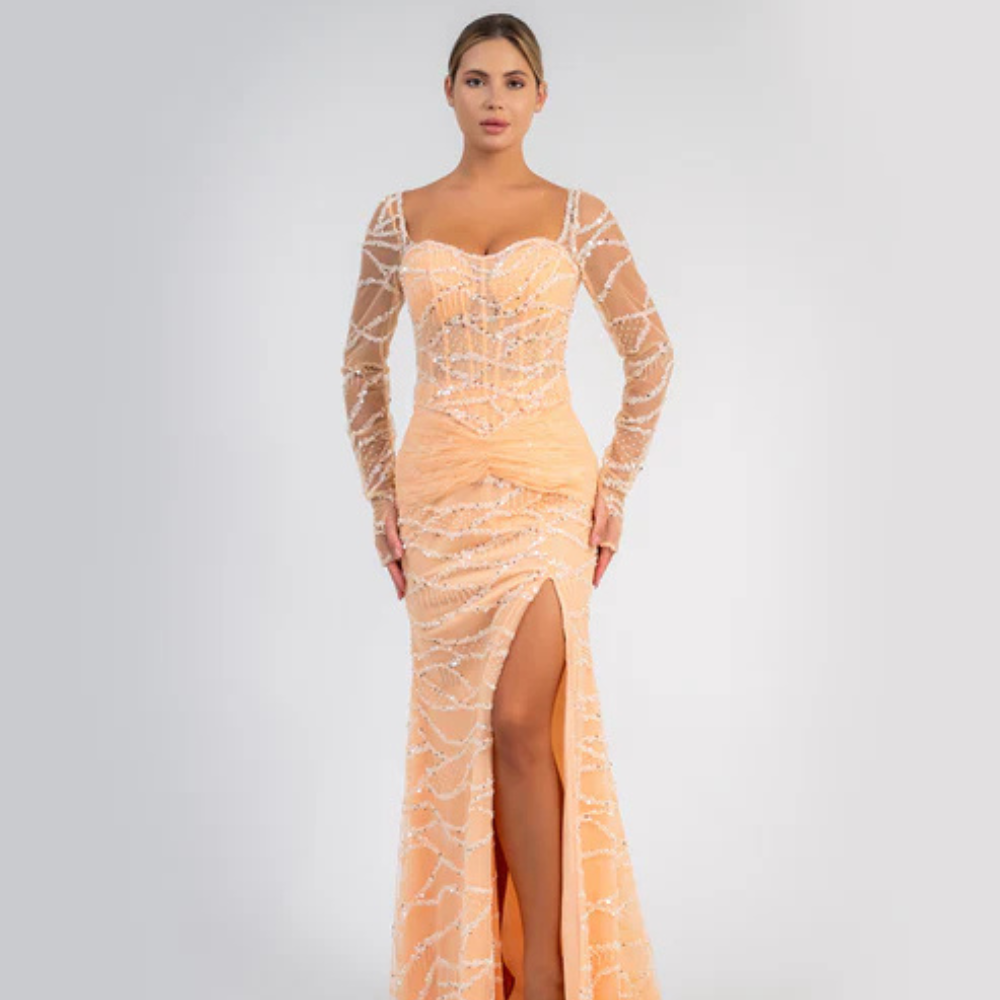 Shop online striking peach gown with shimmering details, sheer sleeves and graceful flowing silhouette, perfect for parties and special occasions.