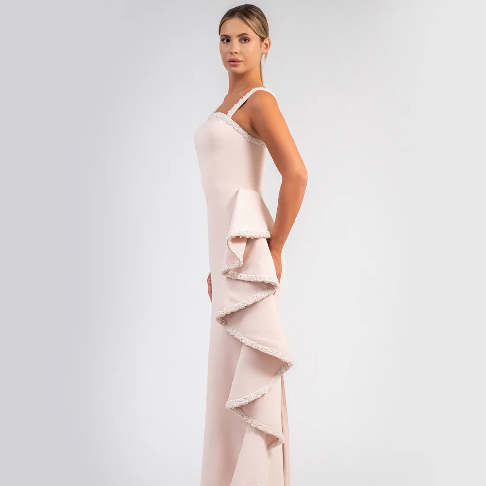 Shop online blush pink crepe gown with sleek silhouette and cascading beaded ruffle details, perfect for parties, receptions and special occasions.