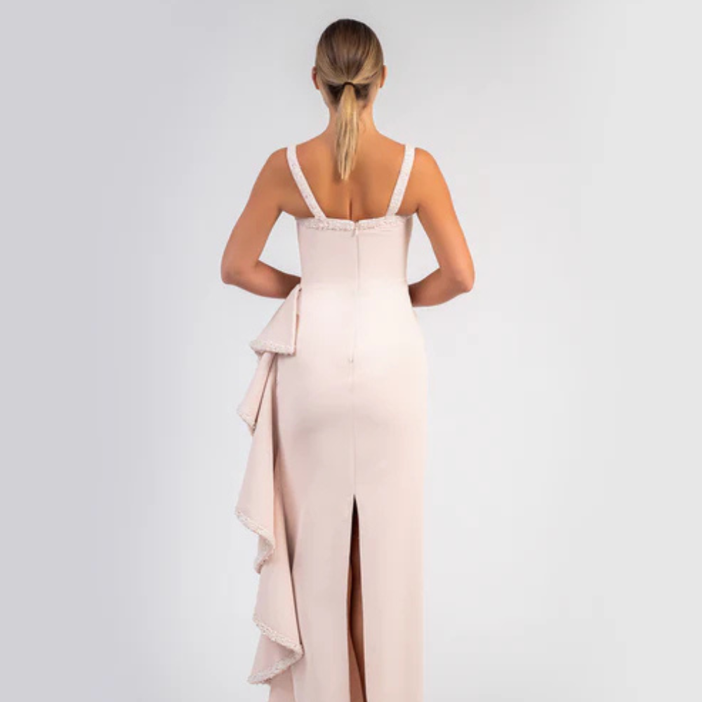 Shop online blush pink crepe gown with sleek silhouette and cascading beaded ruffle details, perfect for parties, receptions and special occasions.