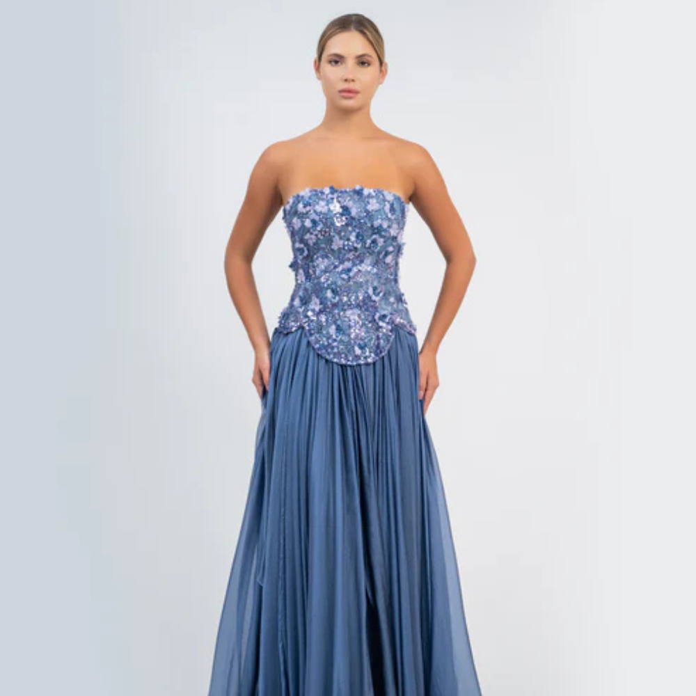 Shop online smoky blue gown with sculpted corset, floral embellishments and graceful flowing pleats, perfect for parties and special occasions.