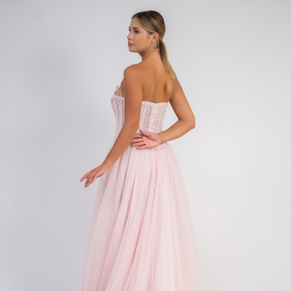 Shop online soft light pink strapless gown with corset bodice, delicate embellishments and flowing layered skirt, perfect for parties and special occasions.