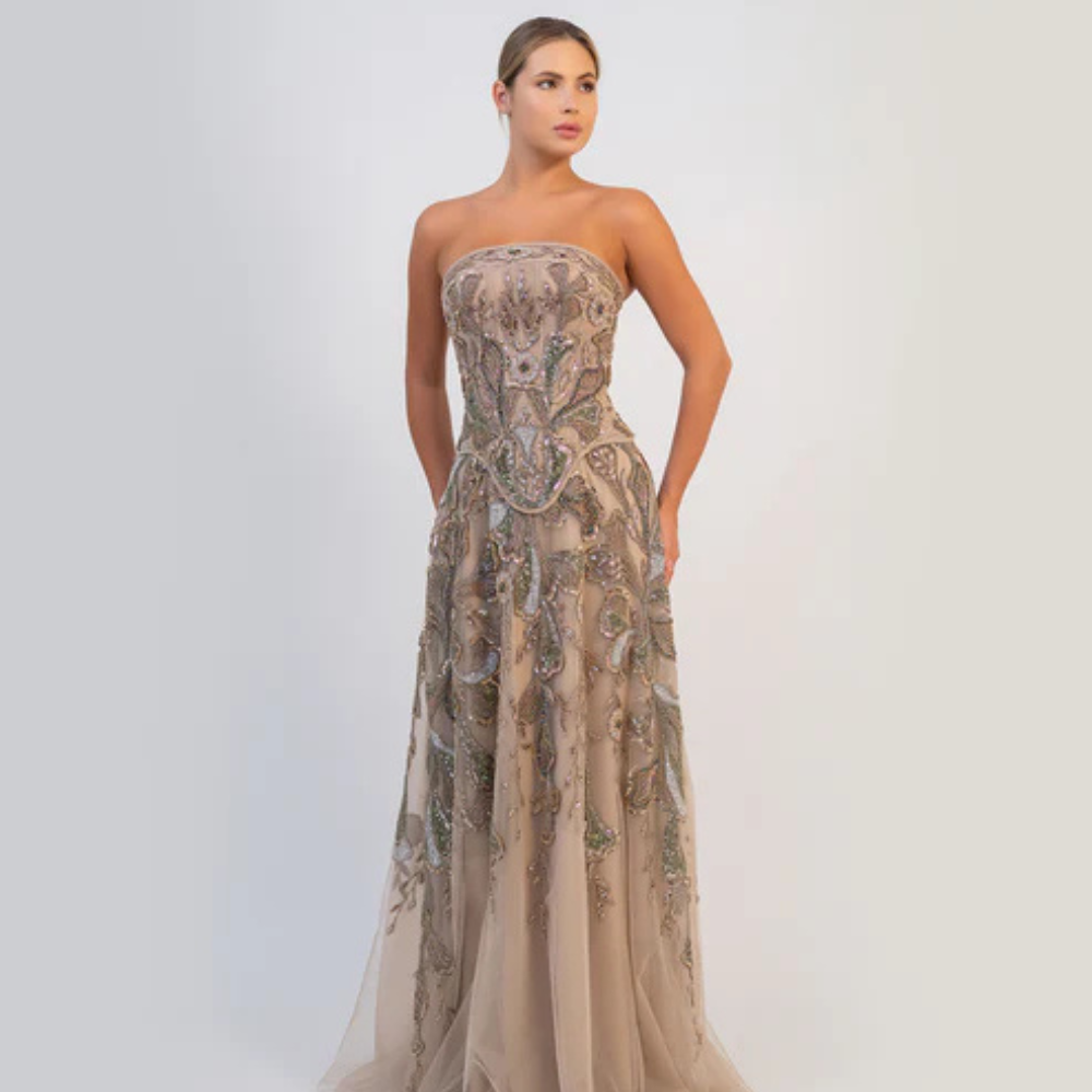 Shop online soft mocha strapless gown with fitted bodice, flowing silhouette and intricate shimmering embellishments, perfect for parties and special occasions.