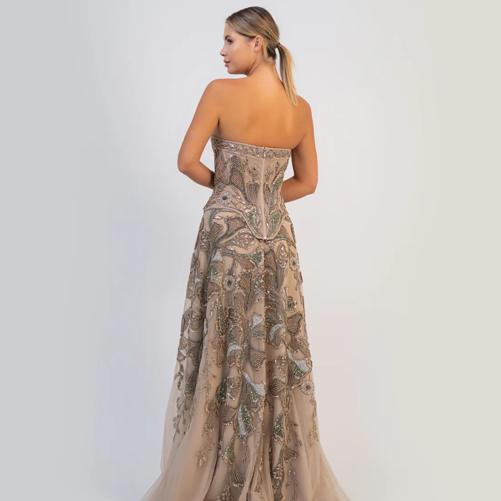 Shop online soft mocha strapless gown with fitted bodice, flowing silhouette and intricate shimmering embellishments, perfect for parties and special occasions.