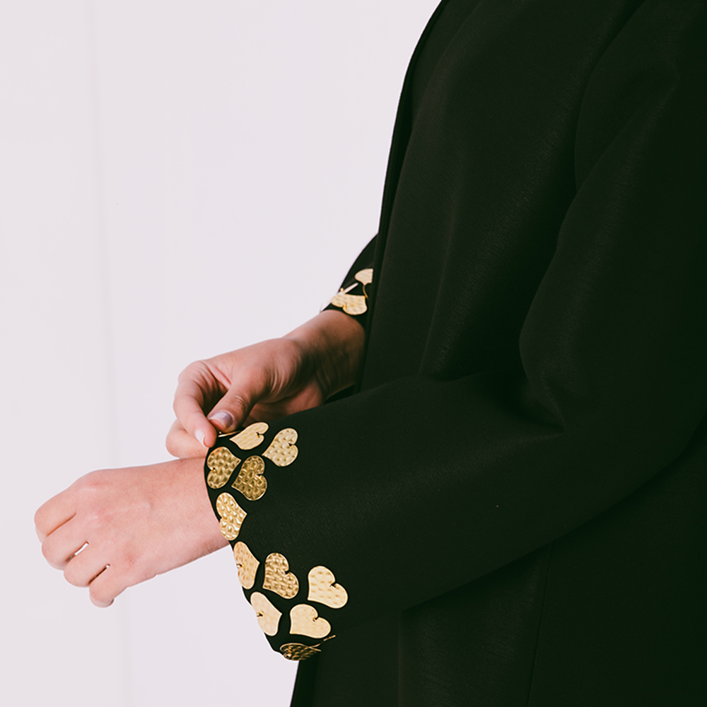 Fitted sleeve abaya embellished with metal heart motifs with gathered hemline. Comes with sheila. Explore designer abaya for women. Shop now!