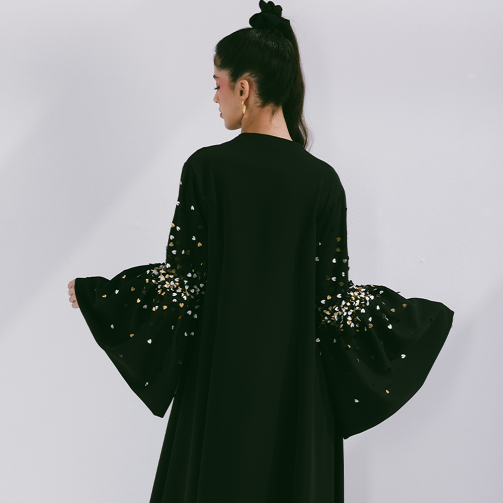 Crepe abaya with puffed sleeve with scattered embroidery. Fabric is crepe. Comes with sheila. Dry clean only. Designer clothing for women. Shop now!