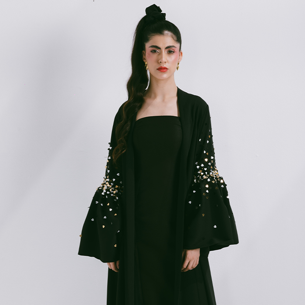 Crepe abaya with puffed sleeve with scattered embroidery. Fabric is crepe. Comes with sheila. Dry clean only. Designer clothing for women. Shop now!