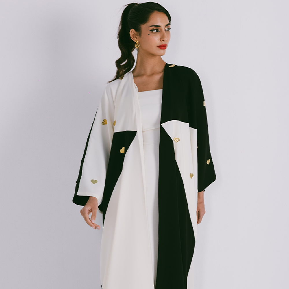 Two tone abaya in crepe with scattered metal heart motifs. Comes in one size only. Comes with sheila. Shop exclusive women clothing. Shop now!