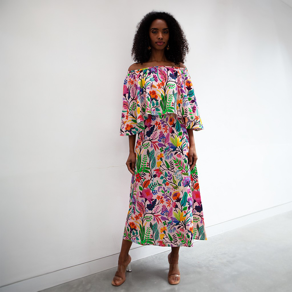 The Adela dress is a an off the shoulder maxi dress with cape detail and elasticated neck line and waist line