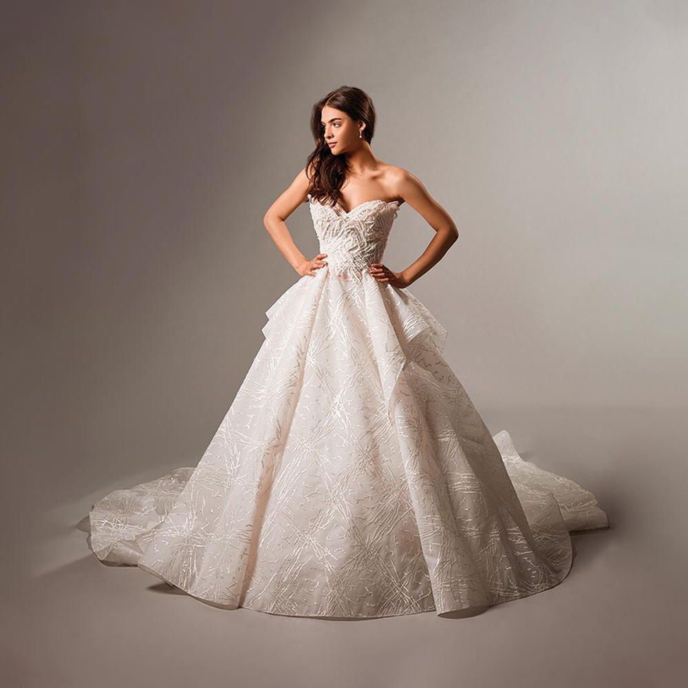 Pretty ruffle off shoulder gown with eclectic and dynamic silhouettes, wedding gowns appear to follow a musical rhythm