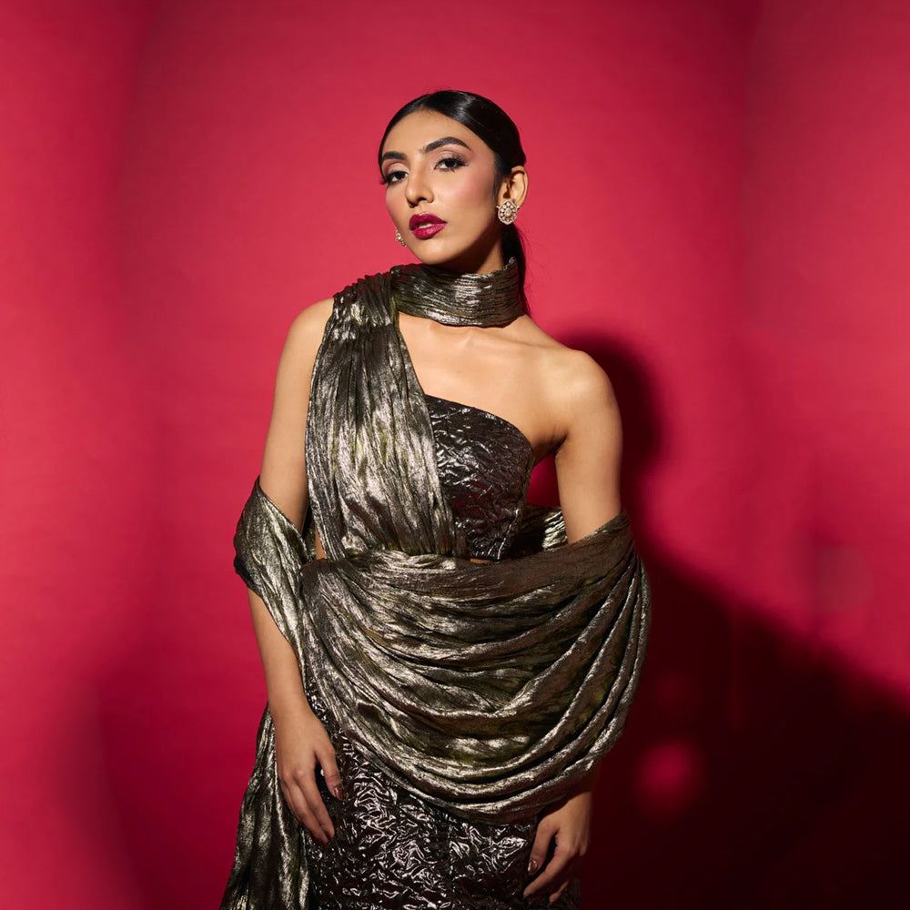 Fusion saree gown with draped neckline and bustier skirt, perfect for events. Shop online from our curated edit of premium fashion.