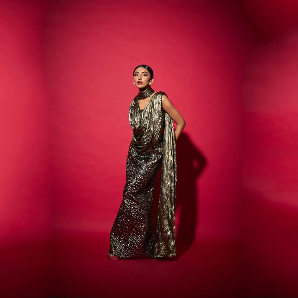 Fusion saree gown with draped neckline and bustier skirt, perfect for events. Shop online from our curated edit of premium fashion.