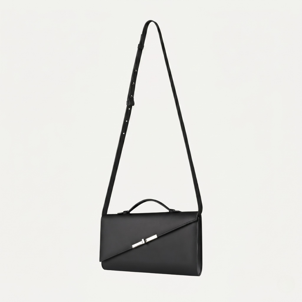 Italian leather clutch with strap and silver hardware, perfect for events. Shop online from our curated edit of premium fashion.