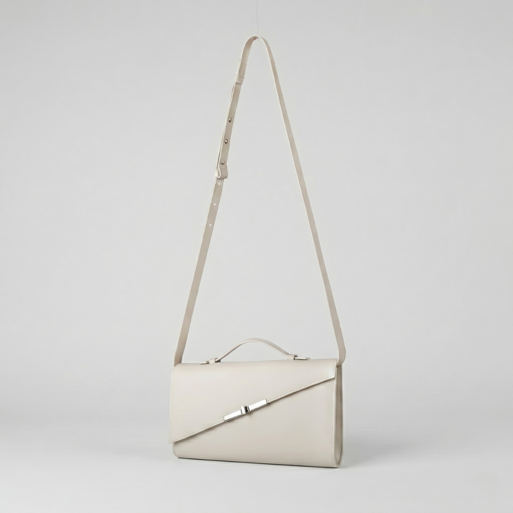 Italian leather clutch with detachable strap and silver hardware, pre order item. Shop online from our curated edit of premium fashion.