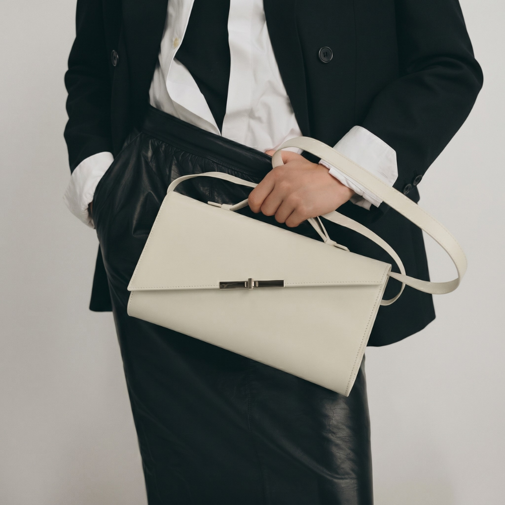 Italian leather clutch with detachable strap and silver hardware, pre order item. Shop online from our curated edit of premium fashion.