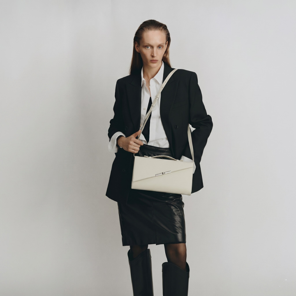 Italian leather clutch with detachable strap and silver hardware, pre order item. Shop online from our curated edit of premium fashion.