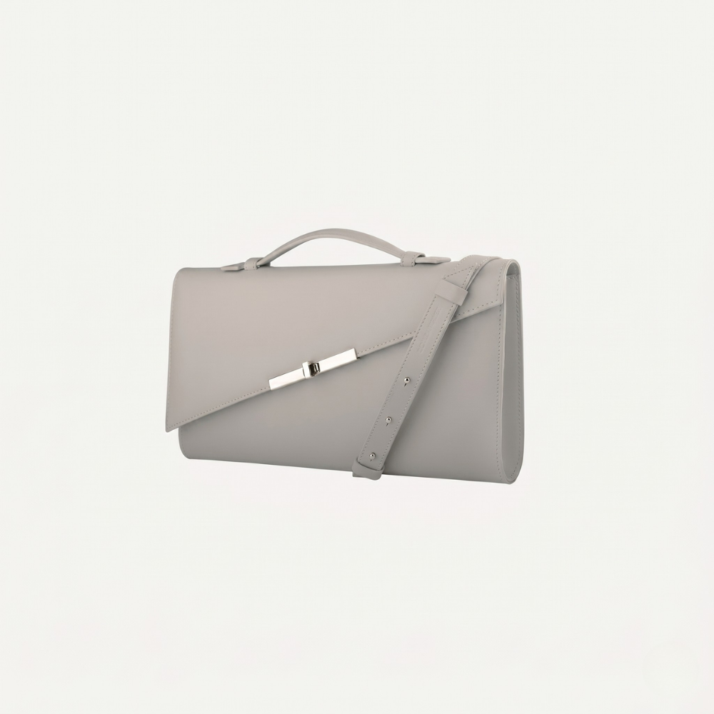 Italian leather clutch with detachable strap and silver hardware. Shop online from our curated edit of premium fashion.