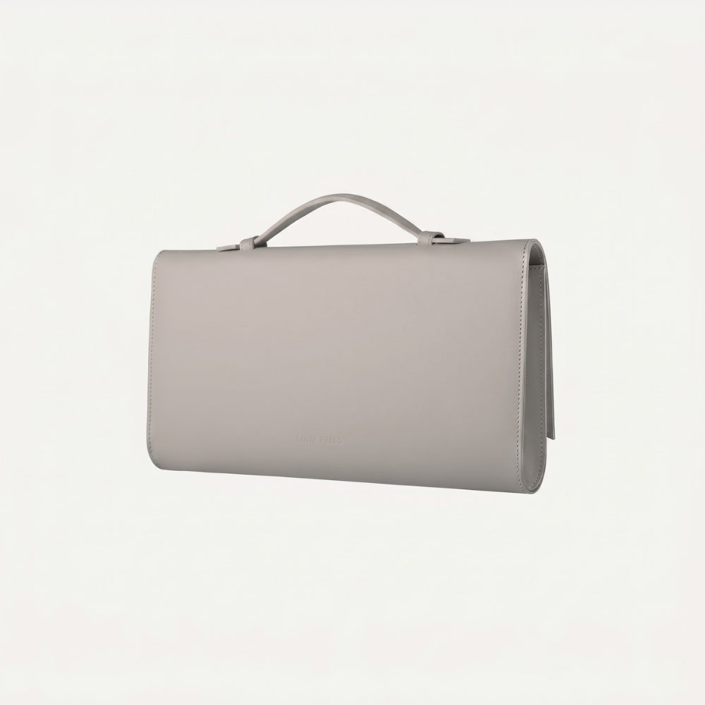 Italian leather clutch with detachable strap and silver hardware. Shop online from our curated edit of premium fashion.