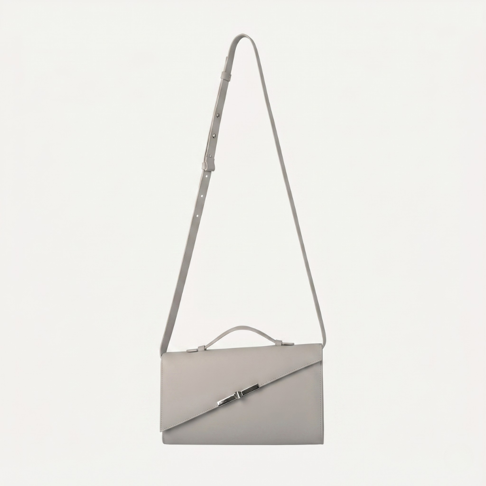Italian leather clutch with detachable strap and silver hardware. Shop online from our curated edit of premium fashion.