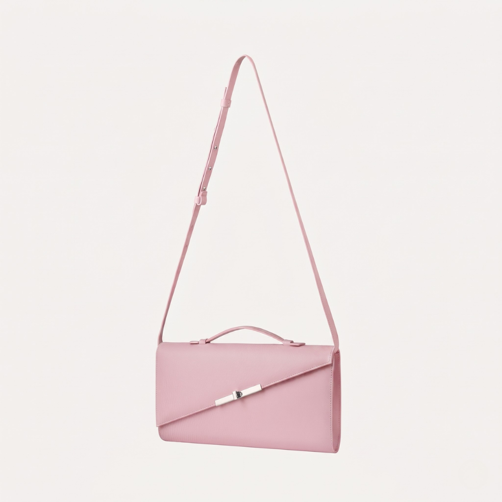 Italian leather clutch with strap and silver hardware, perfect for events. Shop online from our curated edit of premium fashion.