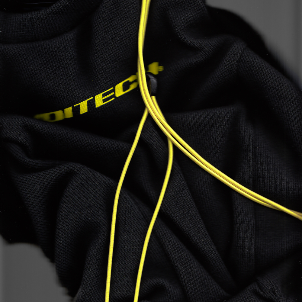 Shop online from our exclusive website and discover the Alpha Bungee Ribbed Vest by Voitech®, featuring ribbed stretch cotton, adjustable bungee detailing, and a bold technical streetwear design.