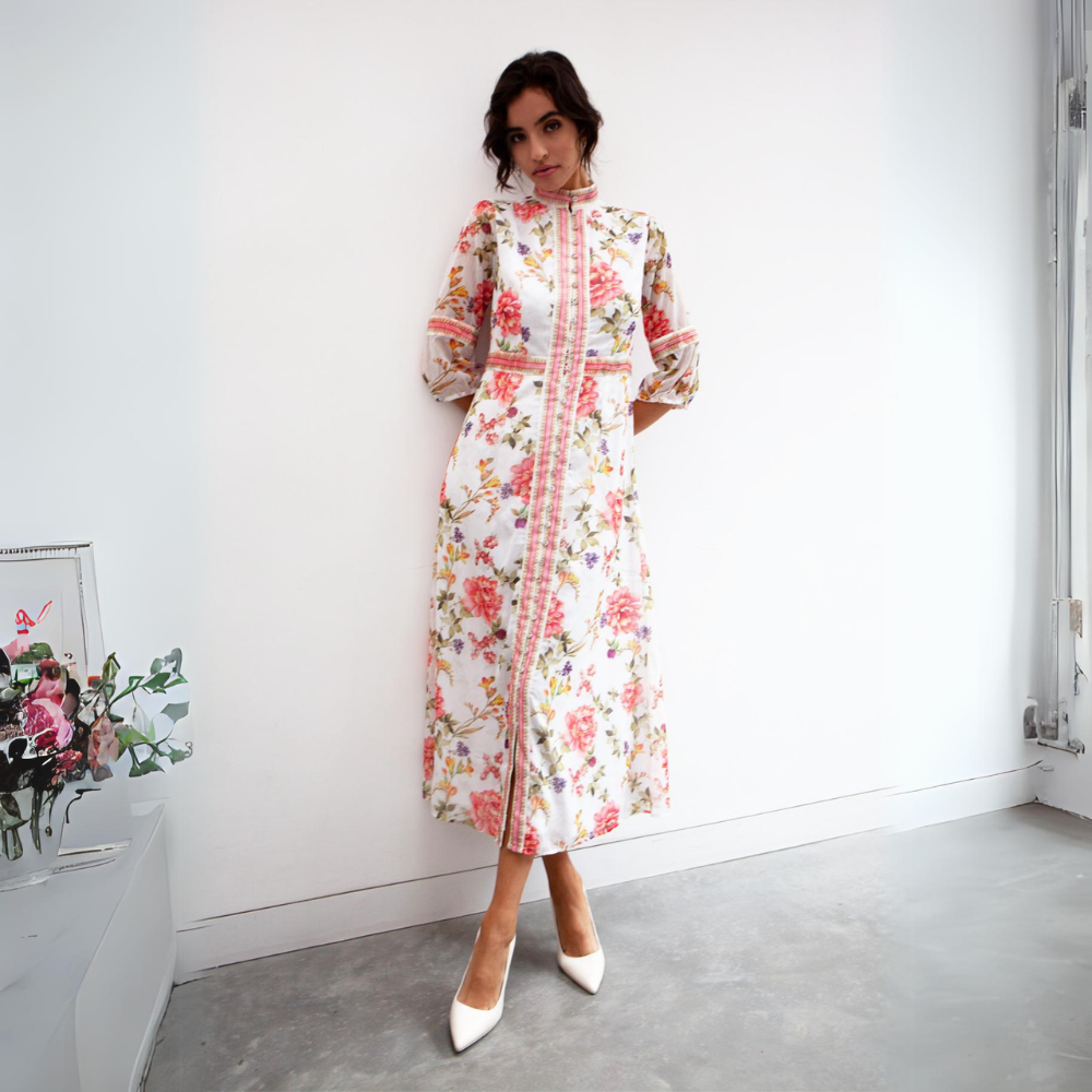 Features a three quarter-length sleeve and central buttons that allows the pattern to be the focus of the dress