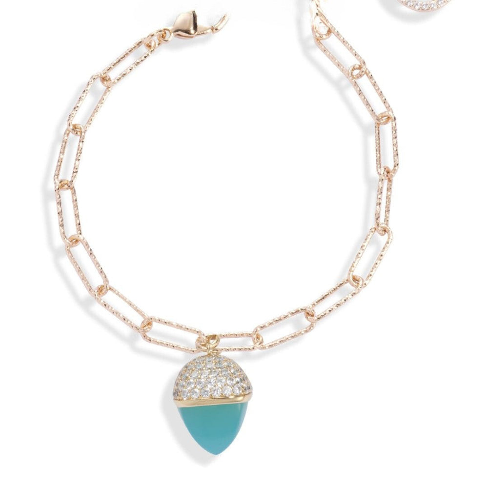 Elegant yellow gold plated bracelet with an amazonite-colored pyramid crystal pendant and sparkling cubic zirconia diamond-cut links. Shop premium jewelry online.
