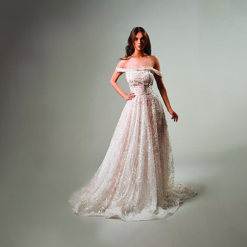 Eclectic and dynamic, wedding gowns appear to follow a musical rhythm with a delicate and wavy movement .
