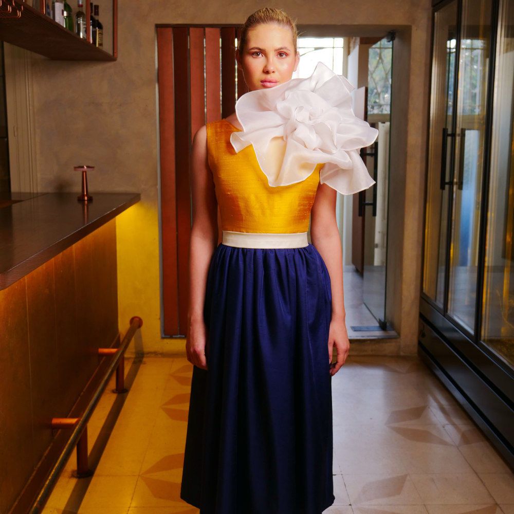 Navy silk shantung dress with yellow bodice, adorned with a white organza flower