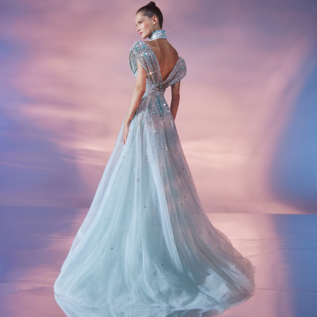 Princess cut Aqua tulle gown, embellished in stones, crystal, and beads.